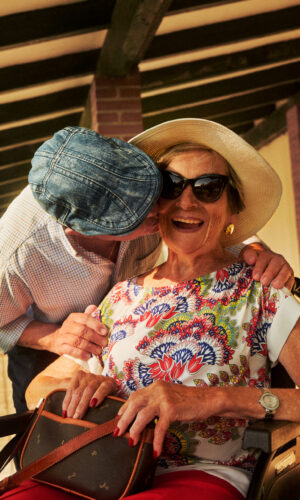 Man Mentor gives Woman kiss on cheek